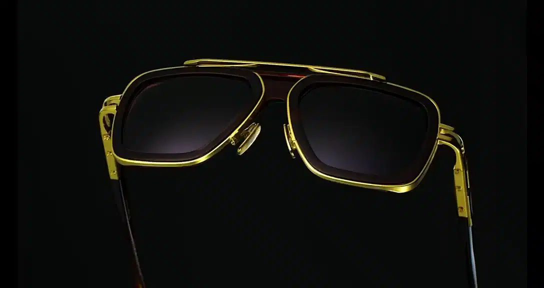 DITA sunglasses with gold titanium double bridge and tortoise acetate lens rims on a black background